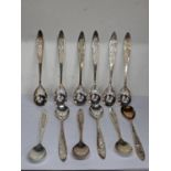 Twelve silver teaspoons having a coiled central design, total weight 185.4g Location: