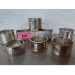 Eight silver non-matching serviette rings 259g Location: Porters