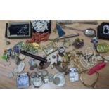 A mixed lot to include Victorian silver coins, lighters, coral necklace horse shoe paste set brooch,