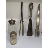 Silver to include a smelling salts jar, a sugar caster, glove stretchers, curling tongs and a shoe