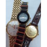 A Rotary gents gold tone watch, a Sekonda ladies watch and a Pelex ladies black and gold tone