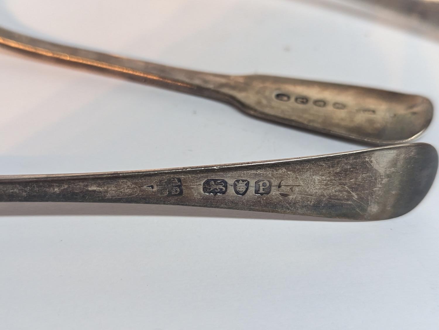 A group of silver flatware to include a Georgian 1806 spoon A/F, 1830 fork and one other 1885 - Image 5 of 5