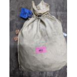 A very loosely sealed coin bag of 1967 halfpenny coins, approximately £5 worth of coin in that year,