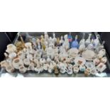 A collection of crested china and ornamental bells to include Tudor Arms china, Goss and Crown