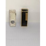 A Dunhill lighter together with silver cigar cutter, hallmarked Birmingham 1991 Location: