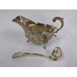 A silver sauceboat 240g, and a Scottish silver sauce ladle 33g Location: Porters