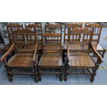 A set of eight early 20th century oak dining chairs having spindle backs and turned front