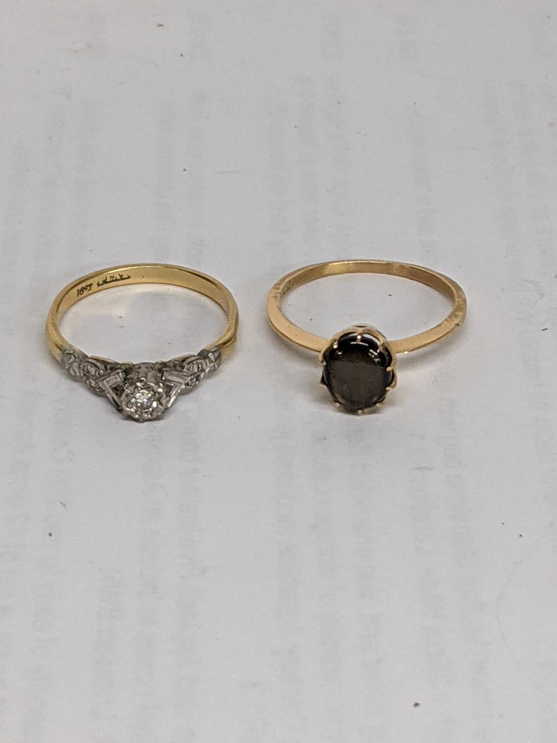 Two 18ct gold rings, one set with a diamond, total weight 5.8g Location: