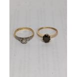 Two 18ct gold rings, one set with a diamond, total weight 5.8g Location: