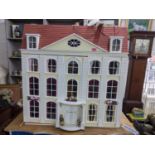 A large doll's house of a Georgian house with mixed furniture and accessories Location: