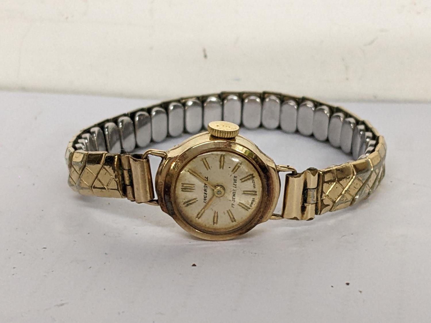 A 9ct gold vintage Ingersol ladies wristwatch on a later expanding bracelet Location: