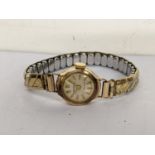 A 9ct gold vintage Ingersol ladies wristwatch on a later expanding bracelet Location: