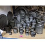 A collection of 18th century and later pewter mugs, plates and bowls, a jelly mould, tobacco jar and