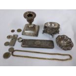 A mixed lot to include a silver weighted candlestick, silver dressing table lid, cigar cutter,