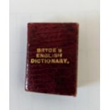 Bryce's English Dictionary, a miniature dictionary bound in red leather Location: