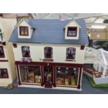 A doll's house of a shop with mixed furniture and accessories Location: