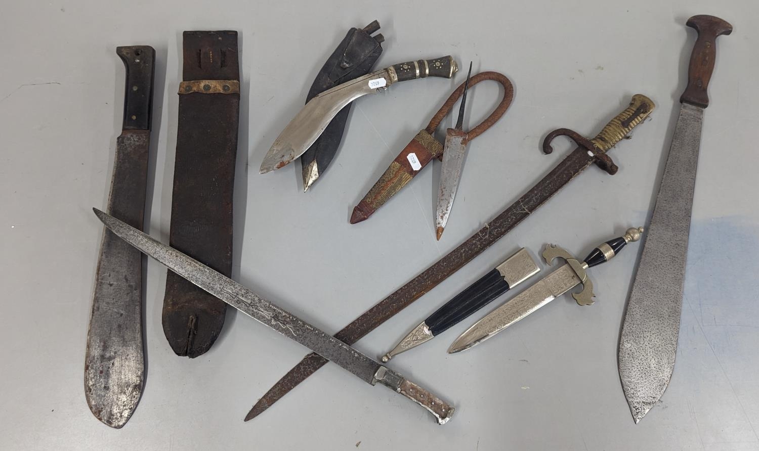 A group of mixed 19th century and later edged weapons to include a French Chassepot bayonet A/F (