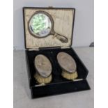An early 20th century silver dressing table set in a fitted case Location: