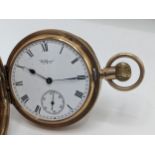 A early 20th century 9ct gold cased Waltham Mass, full hunter pocket watch having a white enamel
