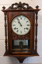 A Victorian walnut cased wall hanging 8 day clock, the case having an acorn and scroll shaped top