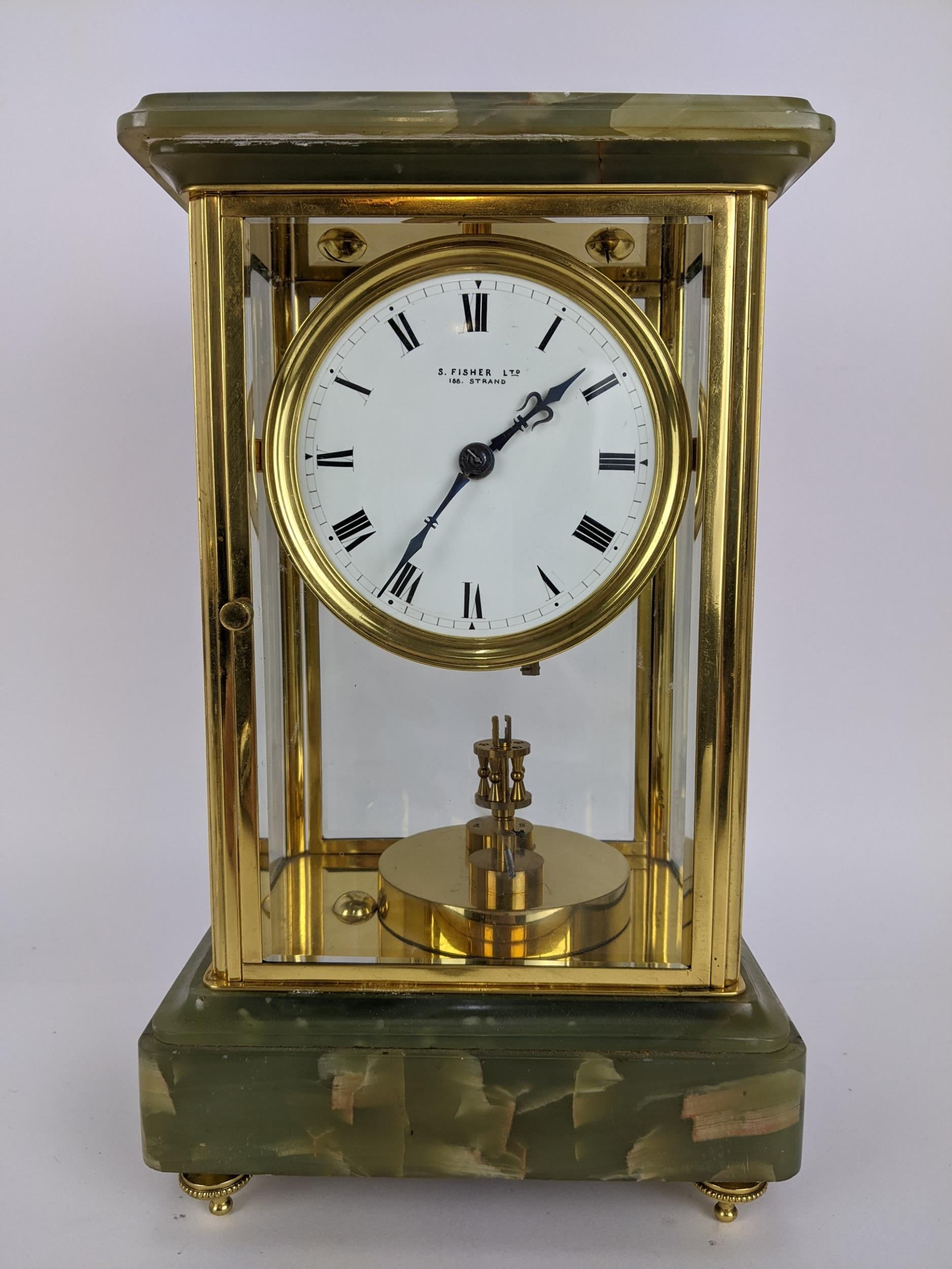 A late 19th century onyx and brass mantle clock, the case having a stepped cornice above a