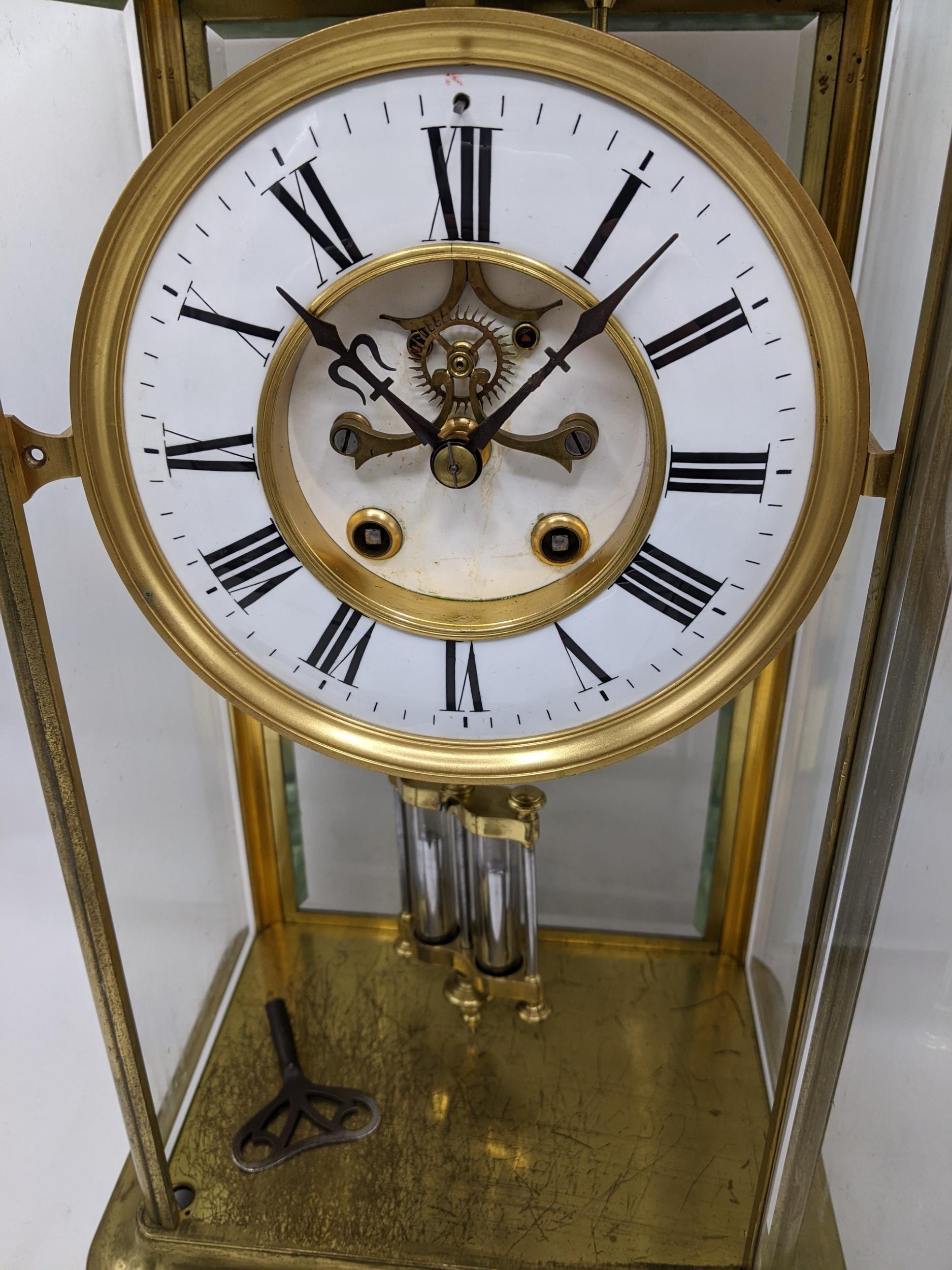 A late 19th century large French gilt brass mantle clock having a white enamel chapter ring with - Image 3 of 7