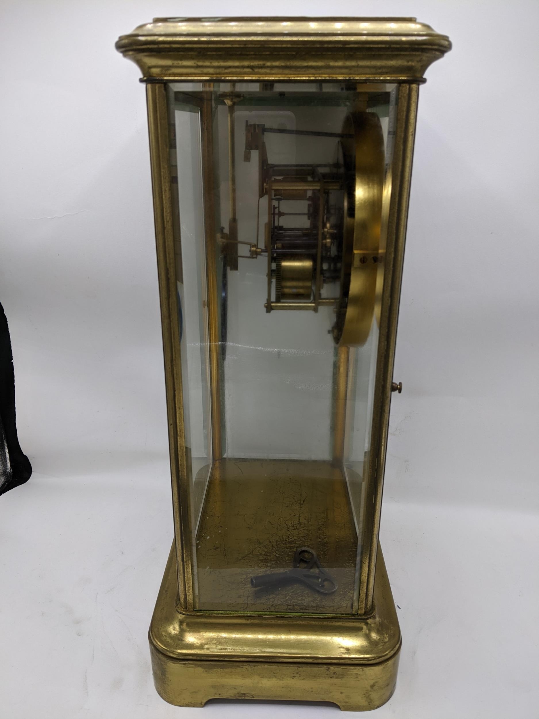 A late 19th century large French gilt brass mantle clock having a white enamel chapter ring with - Image 7 of 7