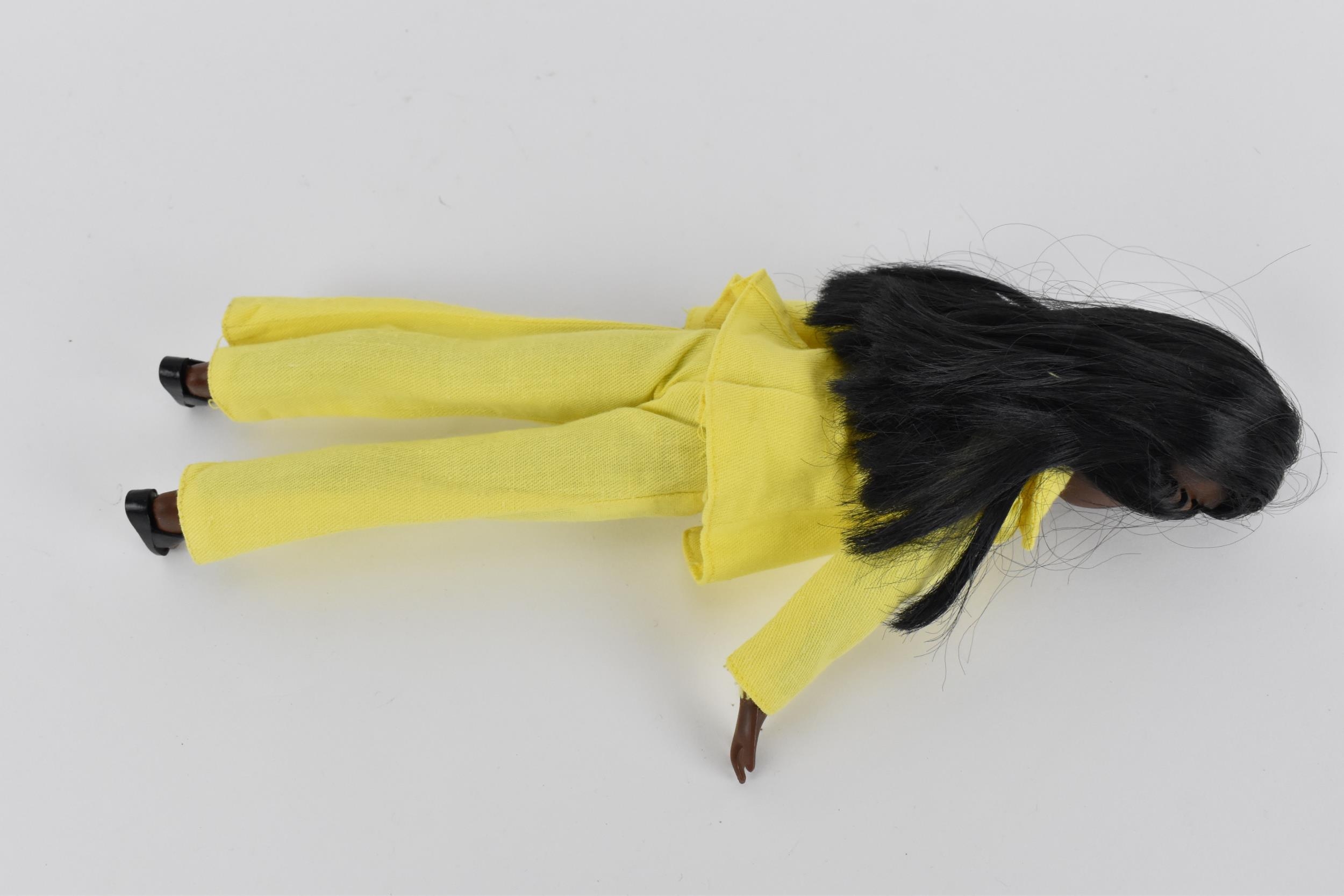 A vintage Sindy's friend Gayle doll in a yellow pant suit, with additional black mules, with painted - Image 4 of 5