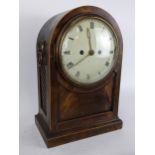 A Regency mahogany bracket clock having an arched top case with boxwood string inlaid, two ring