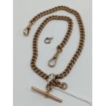 A 9ct rose gold double Albert pocket watch chain having a 9ct T-bar and two 9ct dog clips,