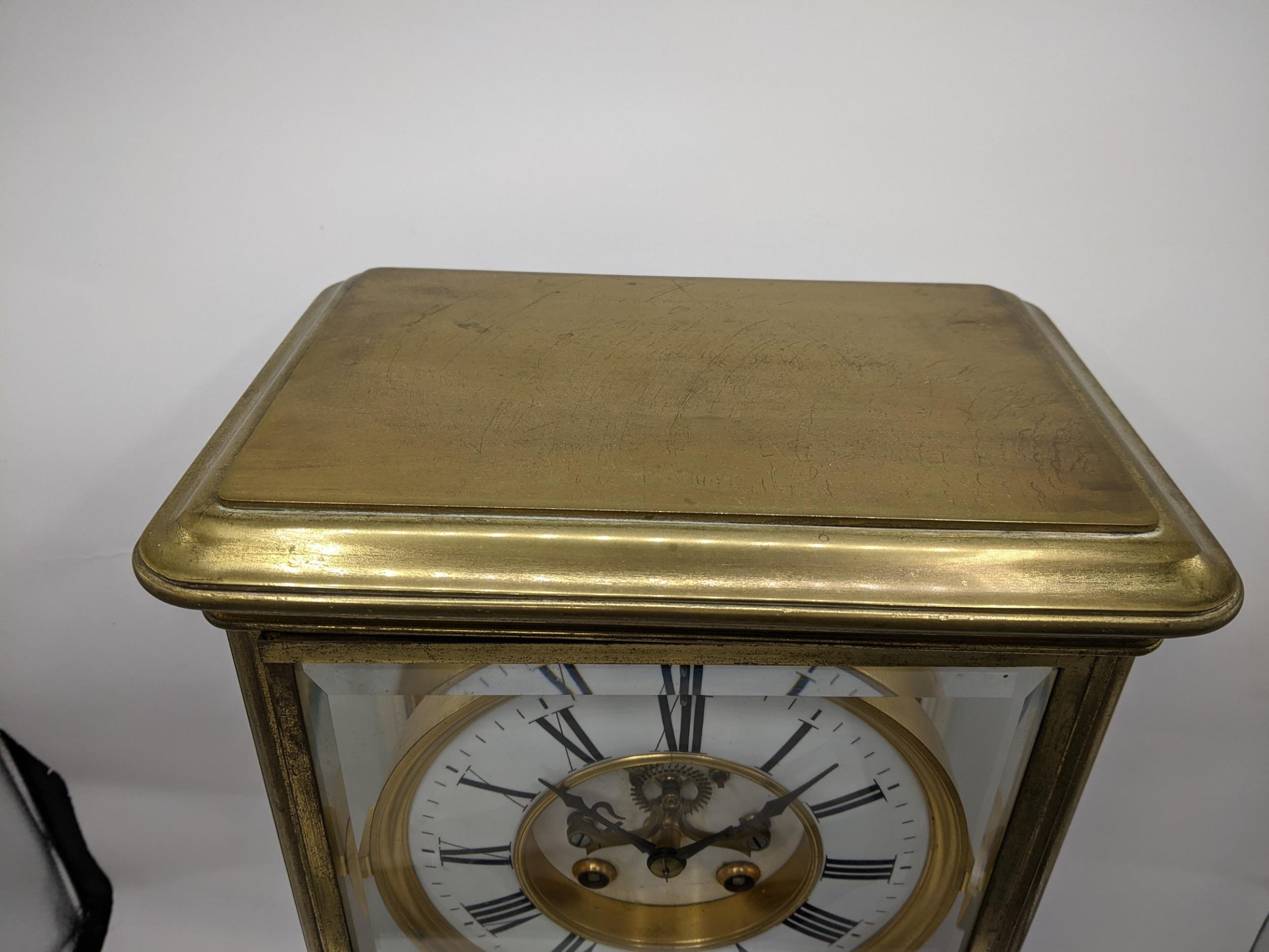 A late 19th century large French gilt brass mantle clock having a white enamel chapter ring with - Image 2 of 7