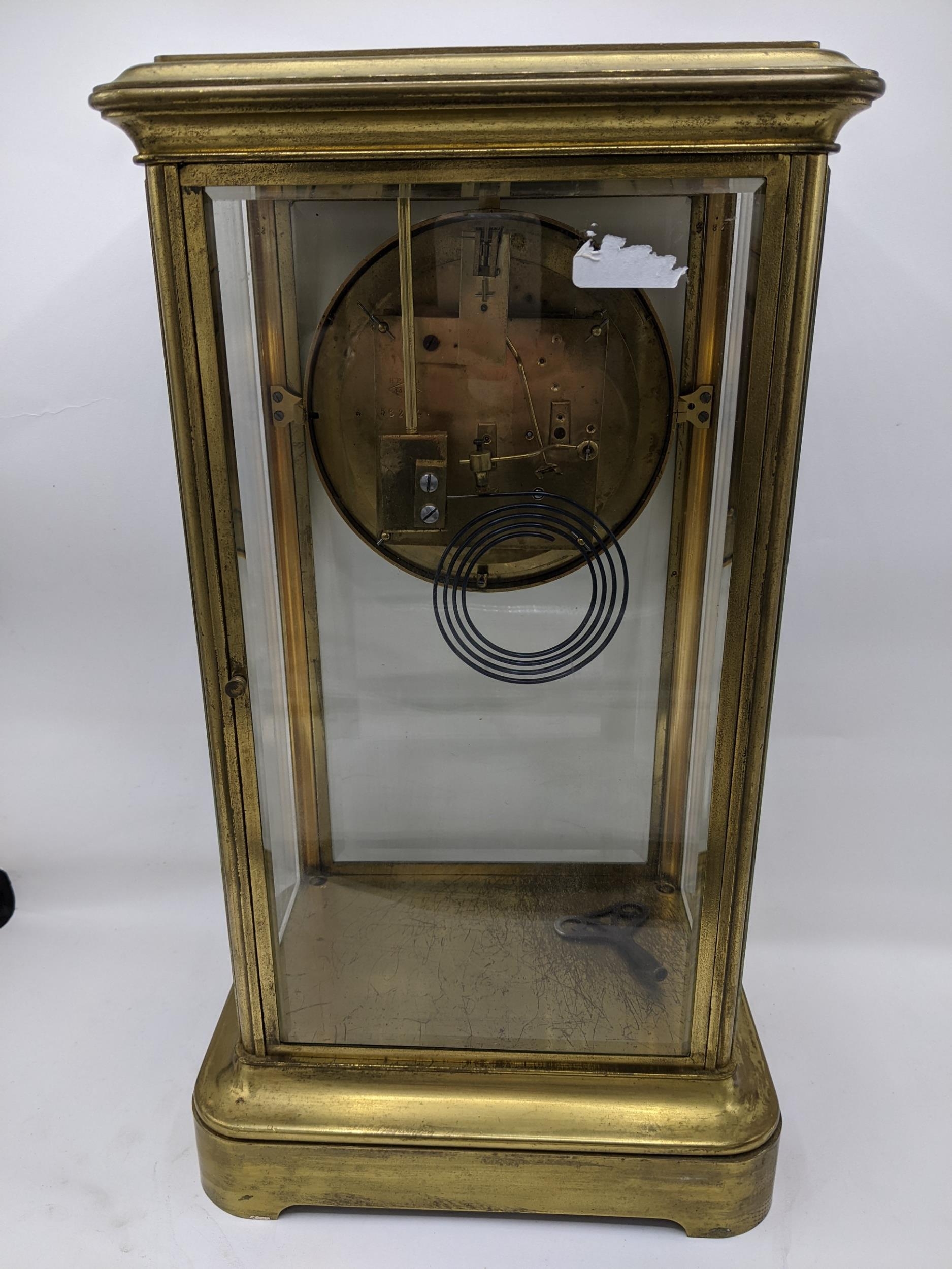 A late 19th century large French gilt brass mantle clock having a white enamel chapter ring with - Image 5 of 7