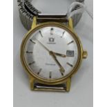 An Omega Geneve, manual winding gents gold plated wristwatch, having a silvered dial with centre