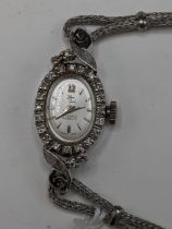 A Filippe Girard manual wind, ladies 14k stamped white gold cased wristwatch inset with 24 diamonds,