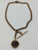 A Victorian 9ct gold Double Albert curb link watch chain having a T-bar and single dog clip, an O