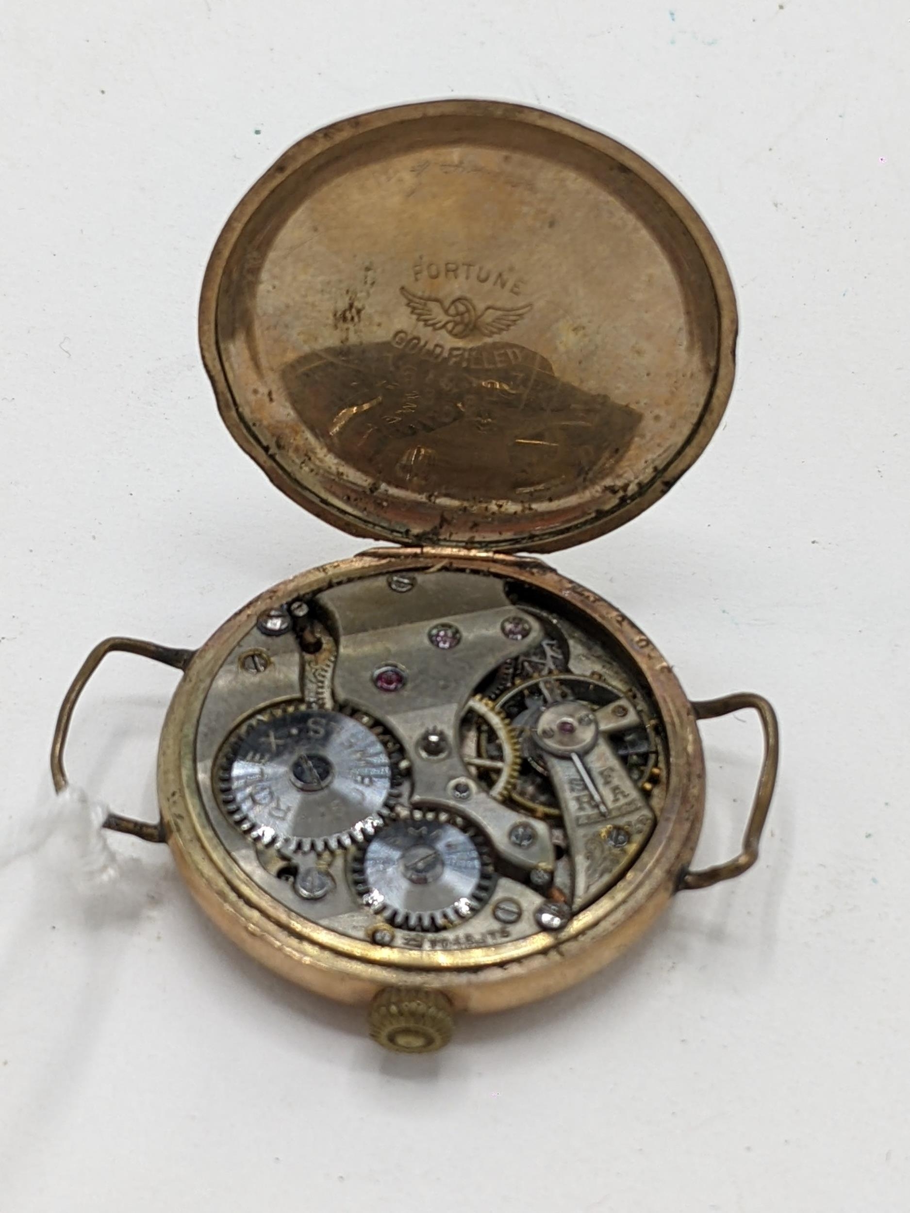 An early 20th century Rolex, gents, manual wind, gold plated, wristwatch, having a white enamel dial - Image 3 of 4