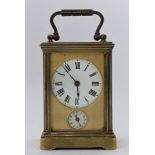 A 19th century French brass miniature carriage alarm clock, the white enamel dial having black Roman