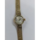 An Omega manual wind, ladies 9ct gold wristwatch, circa 1966, having a silvered dial with baton