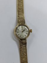 An Omega manual wind, ladies 9ct gold wristwatch, circa 1966, having a silvered dial with baton