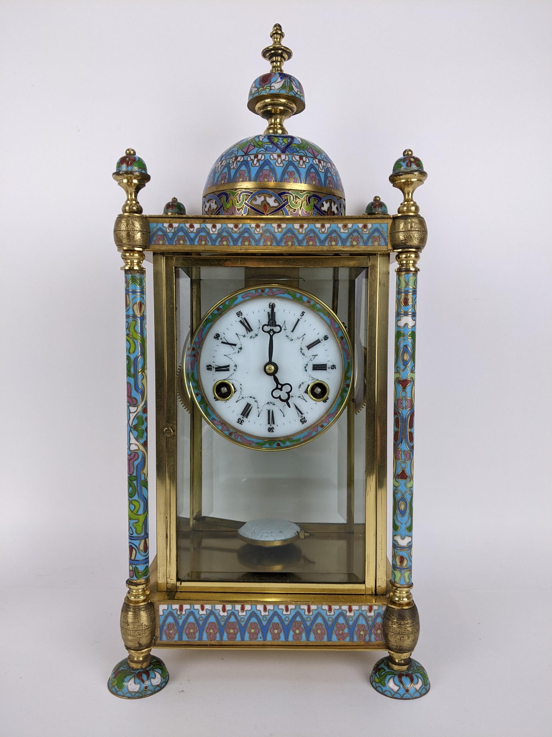 A late 20th century cloisonné and brass mantle clock, the case of architectural design a domed top