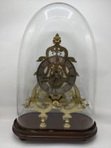 A Victorian brass skeleton clock having a silvered chapter ring with Roman numerals, the movement