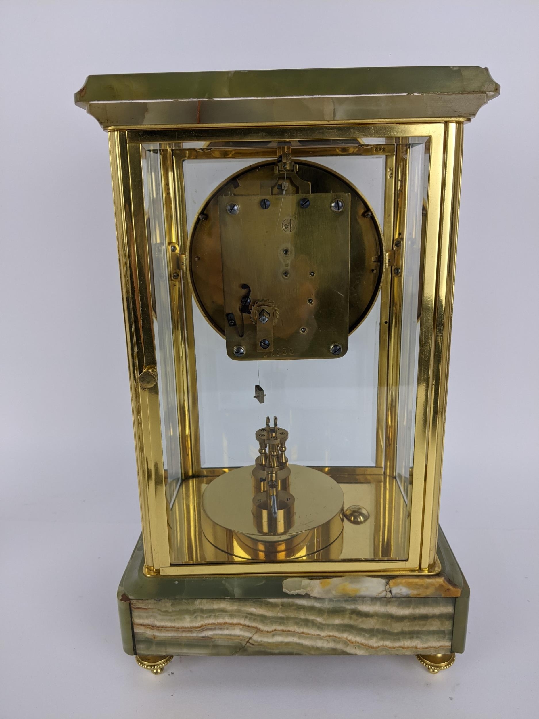 A late 19th century onyx and brass mantle clock, the case having a stepped cornice above a - Image 4 of 6