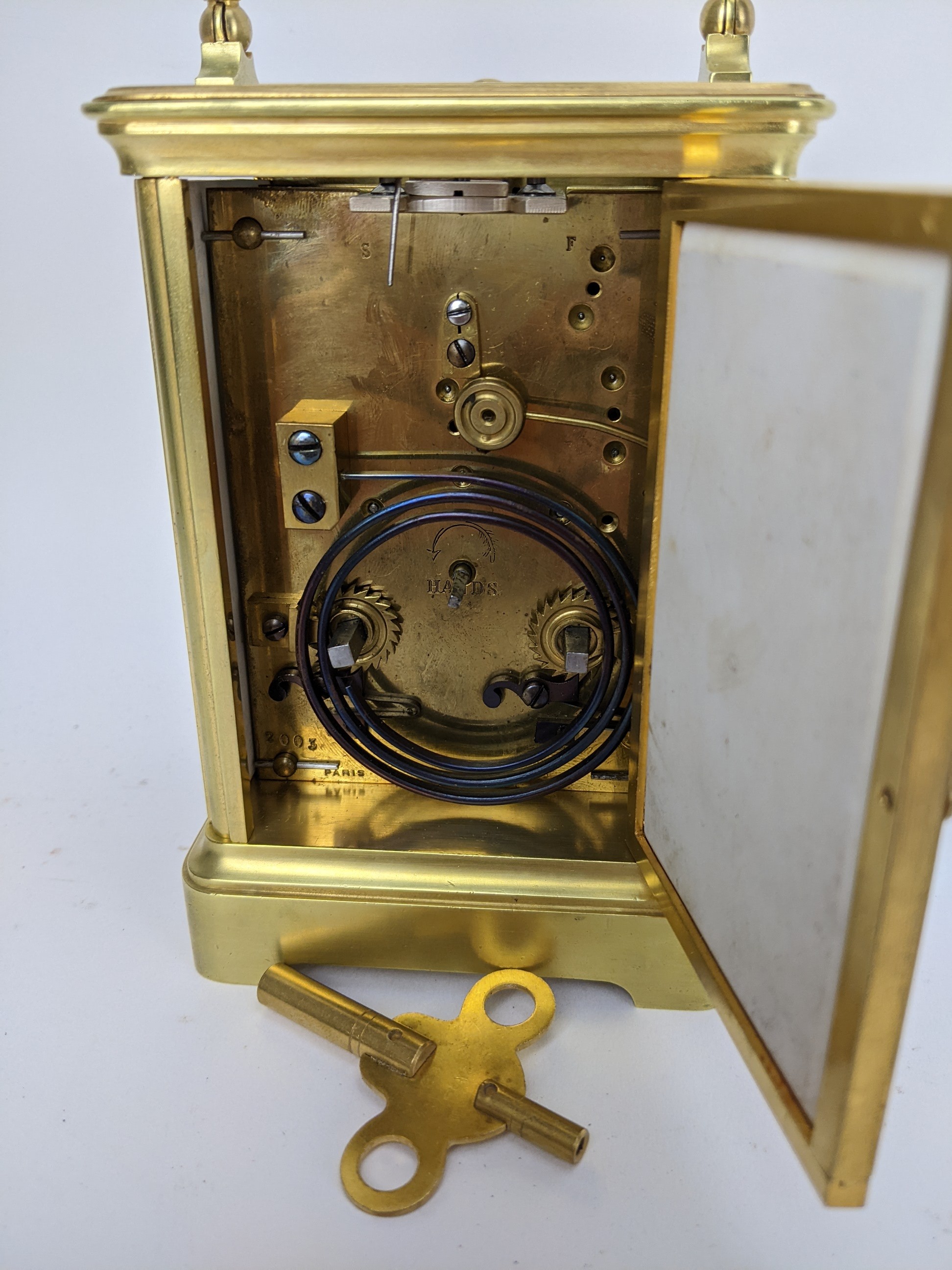 An early 20th century repeater carriage clock, having Sevres style porcelain panels decorated with - Image 5 of 6