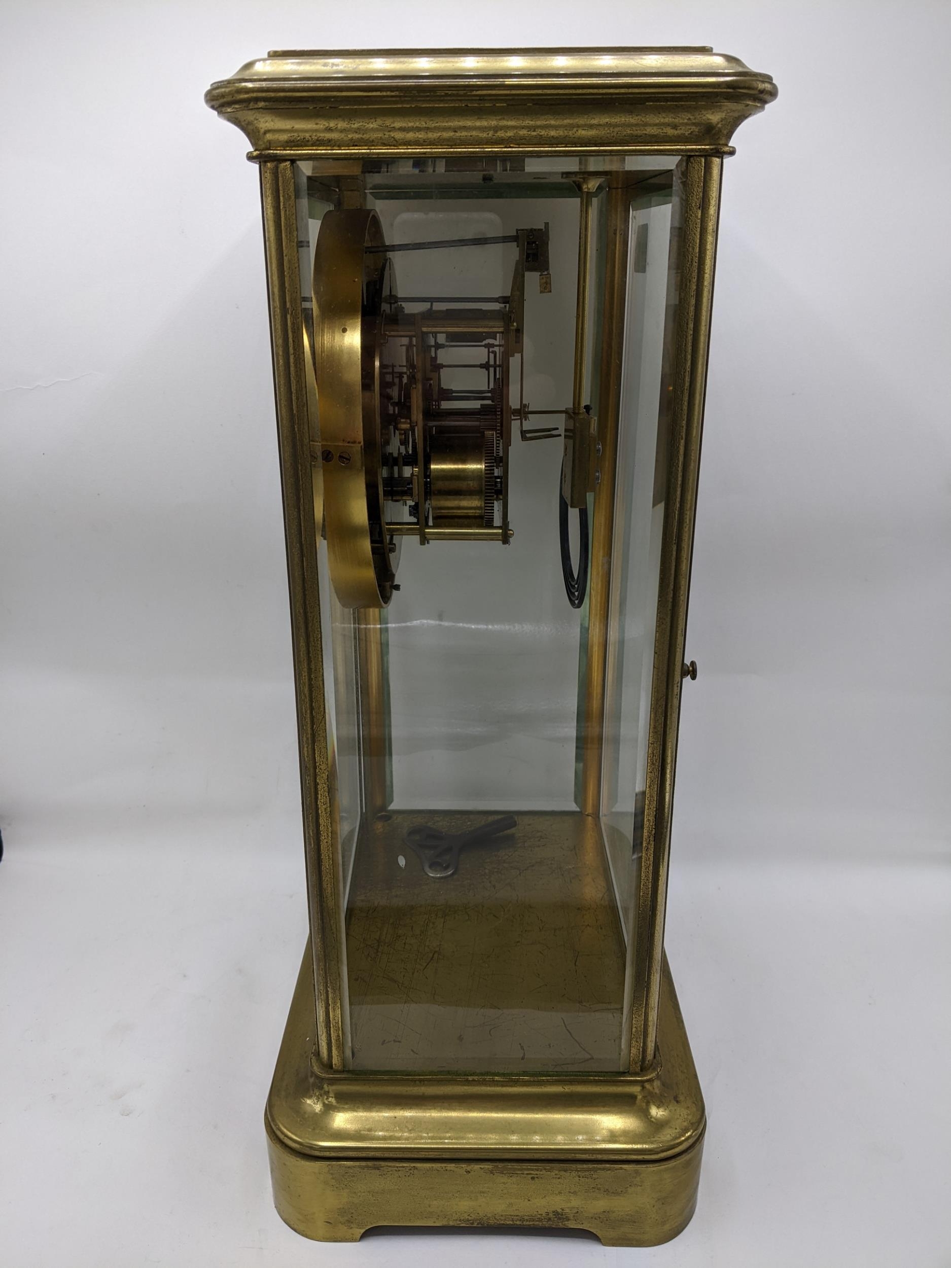 A late 19th century large French gilt brass mantle clock having a white enamel chapter ring with - Image 4 of 7