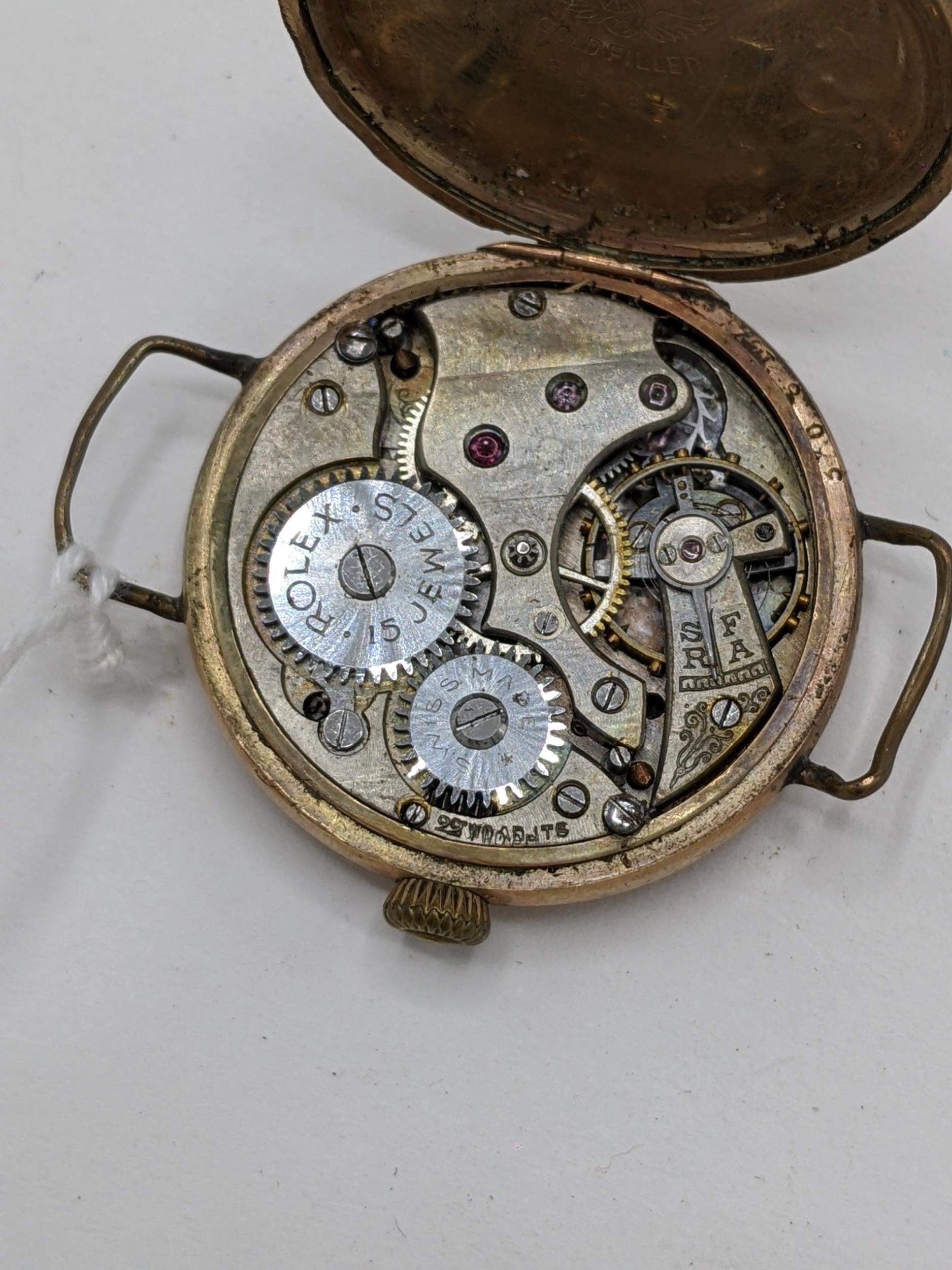 An early 20th century Rolex, gents, manual wind, gold plated, wristwatch, having a white enamel dial - Image 4 of 4