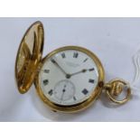 A circa 1947 18ct gold cased full hunter pocket watch, having a white enamel dial signed Russells