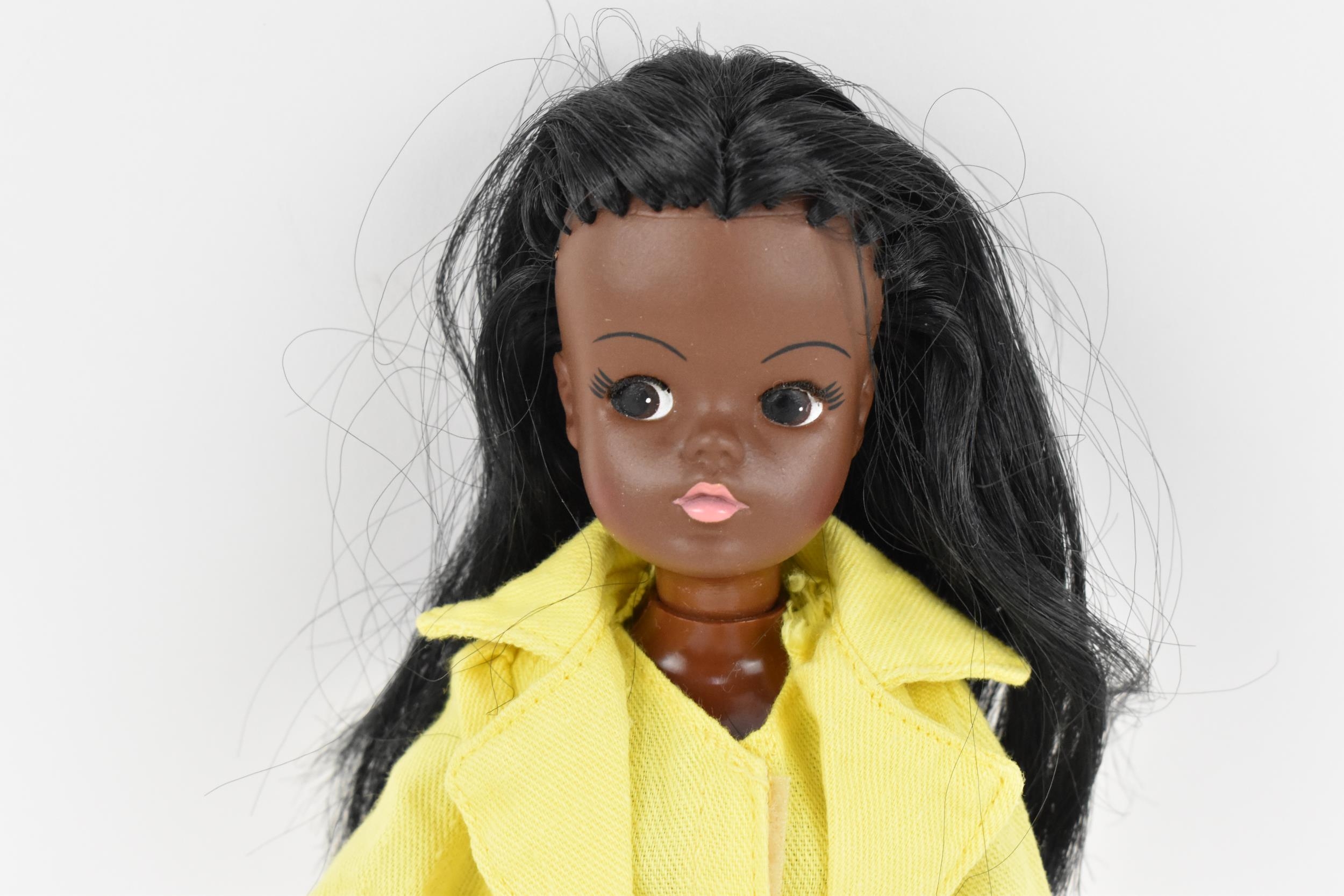 A vintage Sindy's friend Gayle doll in a yellow pant suit, with additional black mules, with painted - Image 2 of 5