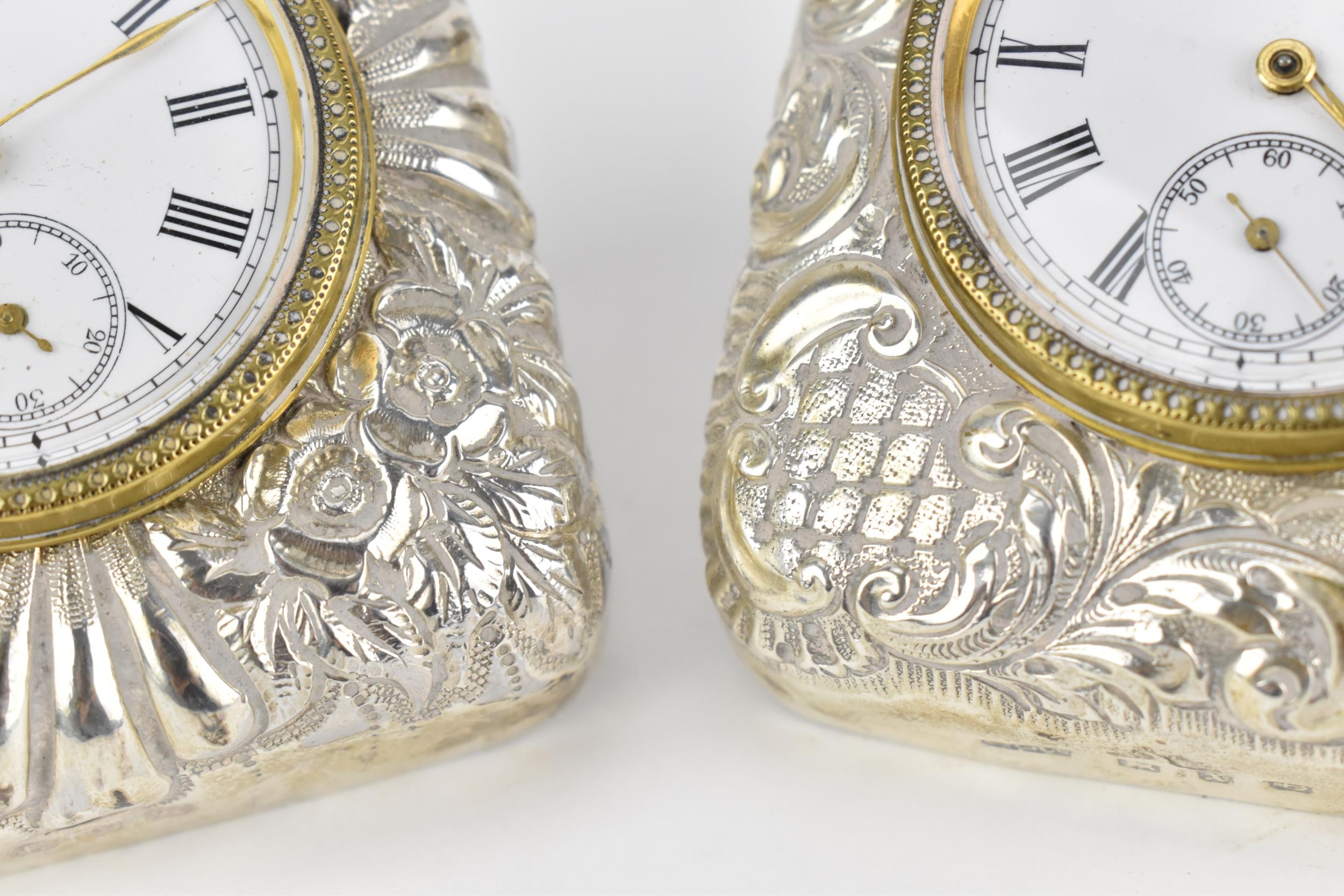 A pair of late Victorian silver cased travel clocks, Birmingham 1897, the cases embossed with - Image 6 of 7