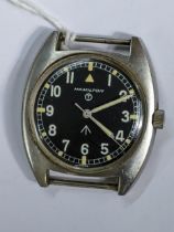 A Hamilton, W10 military issued, gents, stainless steel wristwatch, having a black dial with