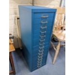 A blue painted metal fifteen-drawer filing cabinet 86.5cm h x 28cm w Location: